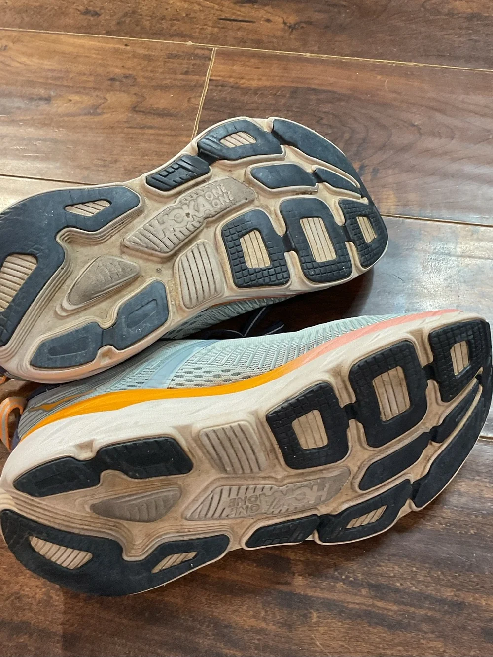Hoka Blue Athletic Shoes with Orange and Pink Accents